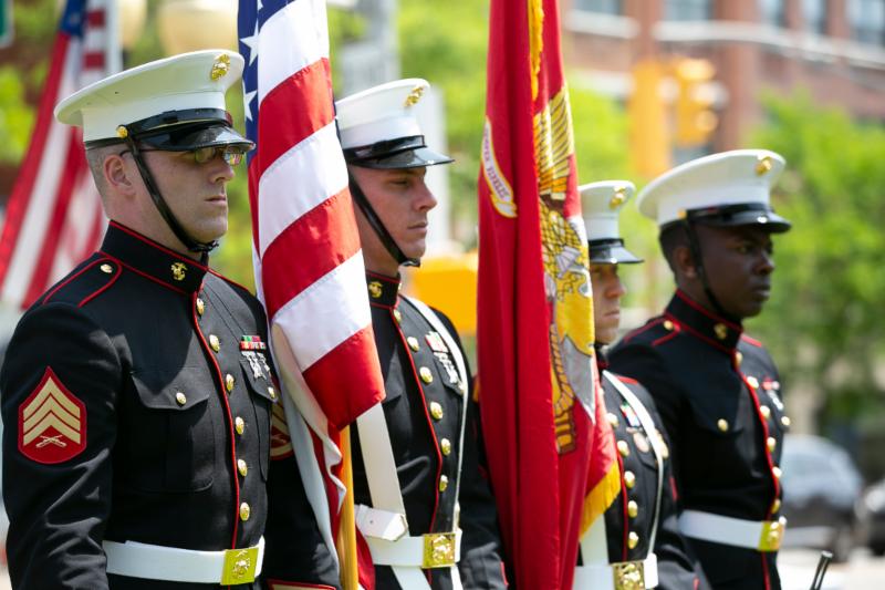 Military Servicemen holding flags